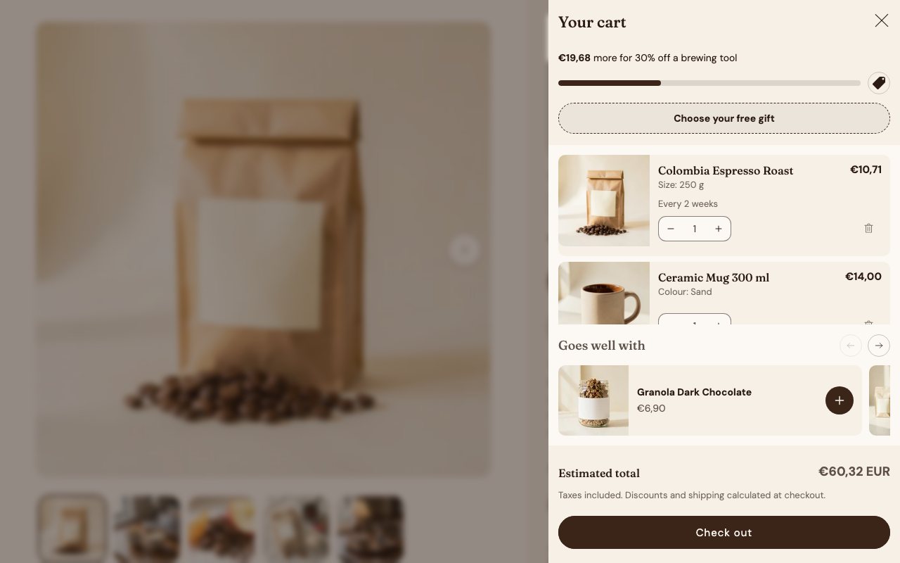 The €50 step reached: the free-gift button appears and the bar counts on to the next reward